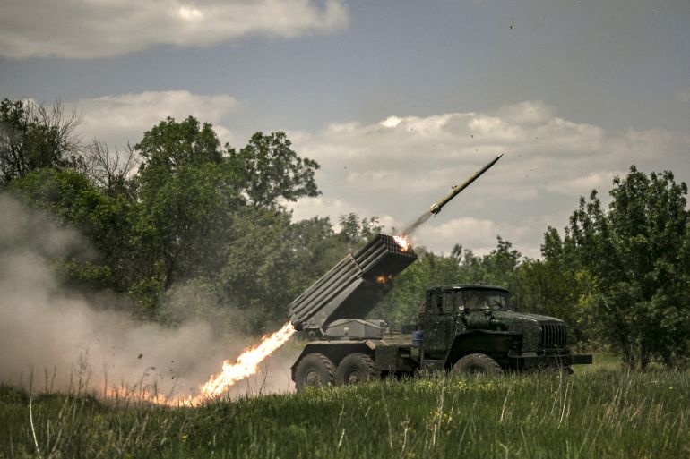 Ukrainian troops fire with surface-to-surface rockets MLRS towards Russian positions at a front line in the eastern Ukrainian region of Donbas