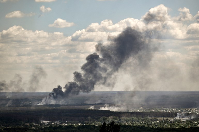 Smoke and dirt rise from shelling in the city of Severodonetsk 