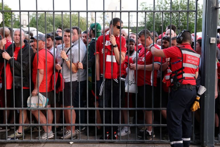 Liverpool fans stand outside unable to get in in time leading to the match being delayed prior to the UEFA Champions League final