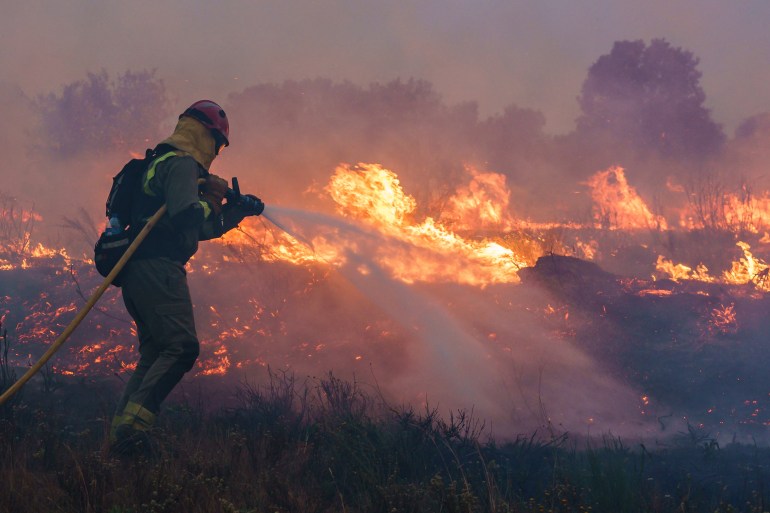 A firefighter at the site of a wildfire in Pumarejo de Tera near Zamora, northern Spain, on June 18, 2022