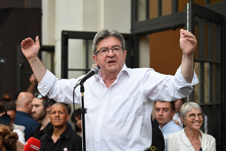 Leader of left-wing coalition Nupes Jean-Luc Melenchon delivers a speech after the first results of the second round of the parliamentary elections in Paris.