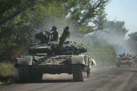 Ukrainian troops move in tanks on a road of the eastern Ukrainian region of Donbas
