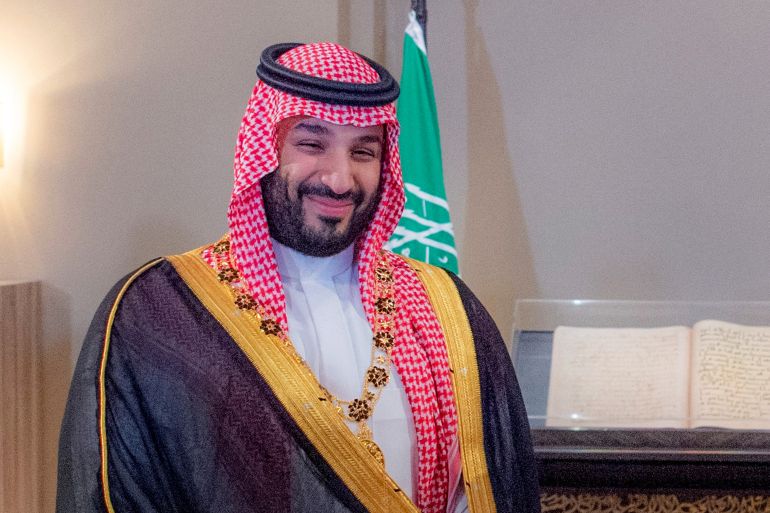 A handout picture released by the Jordanian Royal Palace shows Saudi Crown Prince Mohammed bin Salman smiling