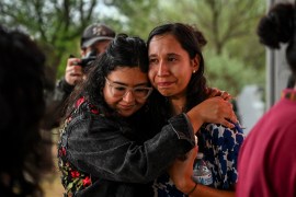 Residents of San Antonio cry as they attend a vigil for the victims found in an abandoned truck in San Antonio, Texas, on June 28, 2022 [Chandan Khanna/ AFP]