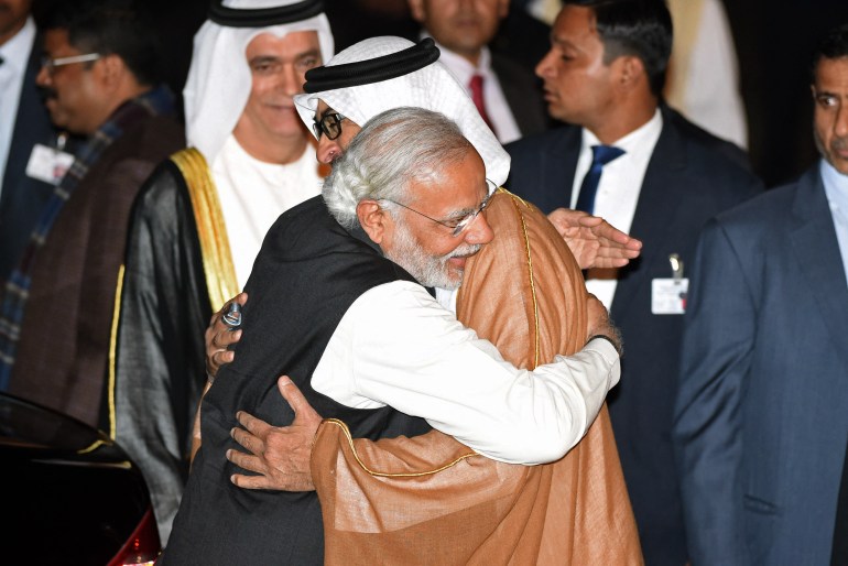 Indian Prime Minister Narendra Modi (L) hugs Crown Prince of Abu Dhabi Sheikh Mohammed Bin Zayed Al Nahyan