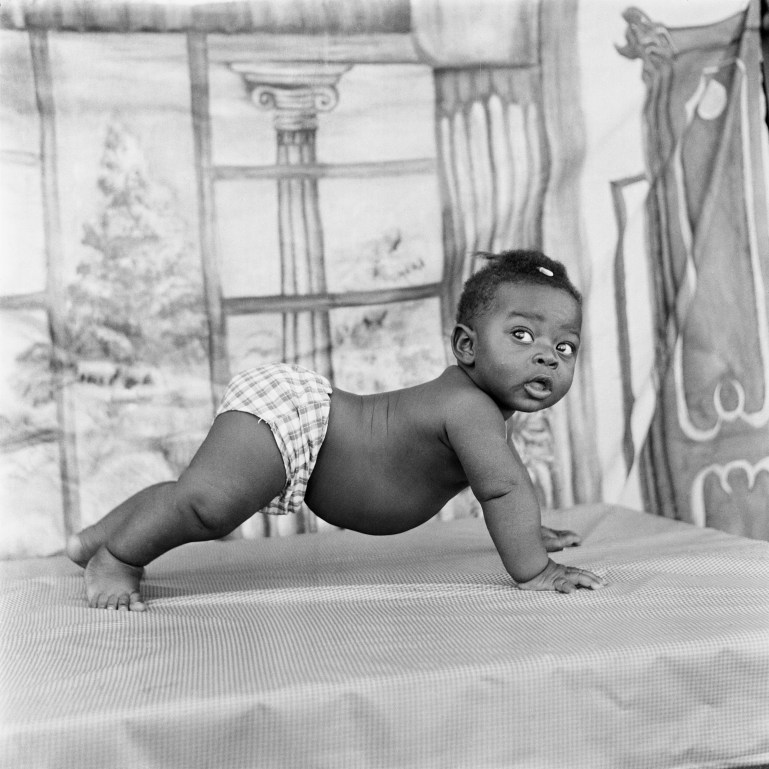 Photo by James Barnor of a baby on all fours