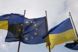 Ukrainian and EU flags fly in front of the Presidential Administration in Kiev, Ukraine