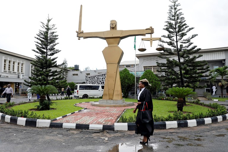A lawyer walks through the compound at the Federal High Court in Ikoyi district in Lagos, Nigeria, May 8, 2018. [File: Akintunde Akinleye/Reuters]