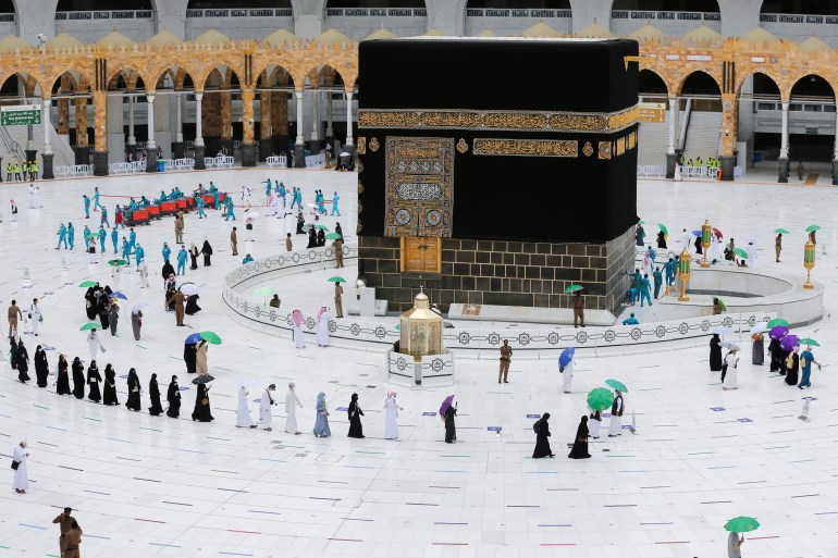 Pilgrims keeping social distance at the Kaaba