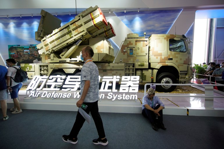 A man walks past a model of LY-70 air defense missile weapon system displayed at the China International Aviation and Aerospace Exhibition, or Airshow China, in Zhuhai, Guangdong province, China September 29, 2021.
