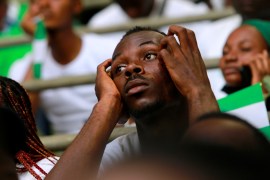 A Nigeria football supporter looks on during the World Cup qualifier between Nigeria and Ghana [Afolabi Sotunde/Reuters]