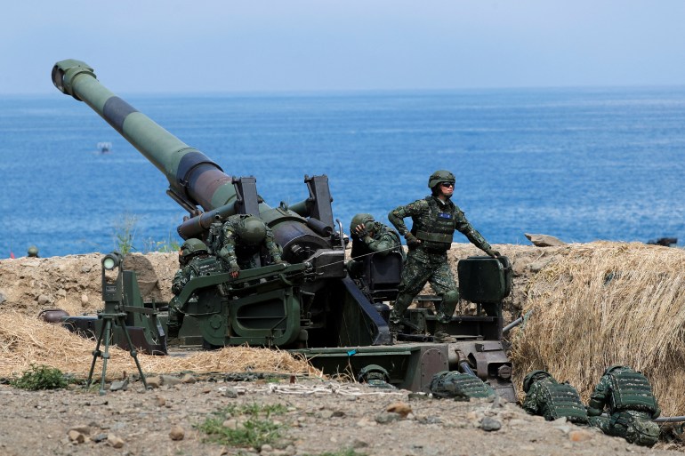Taiwan troops with an artillery unit take part in exercises simulating a Chinese invasion of the island
