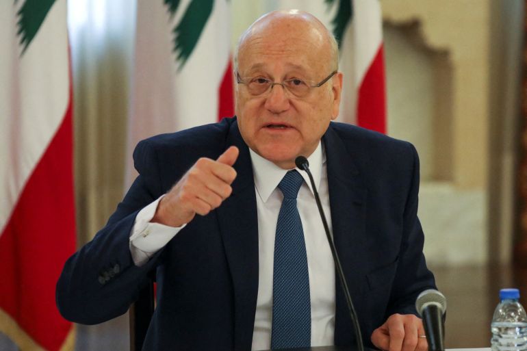 Lebanese Prime Minister Najib Mikati gestures during a news conference on the latest developments in the country, at the government palace in Beirut