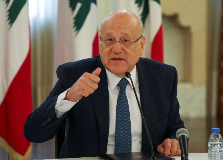 Lebanese Prime Minister Najib Mikati gestures during a news conference on the latest developments in the country, at the government palace in Beirut