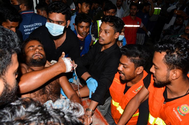 An injured victim is brought to a hospital after a massive fire broke out in an inland container depot at Sitakund
