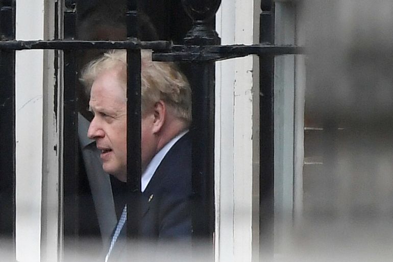 British Prime Minister Boris Johnson leaves from the back entrance of Downing Street in London