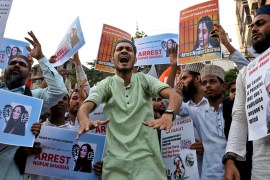 People shout slogans as they hold placards during a protest in Kolkata demanding the arrest of BJP member Nupur Sharma for her blasphemous comments on Prophet Muhammad [Rupak De Chowdhuri/Reuters]