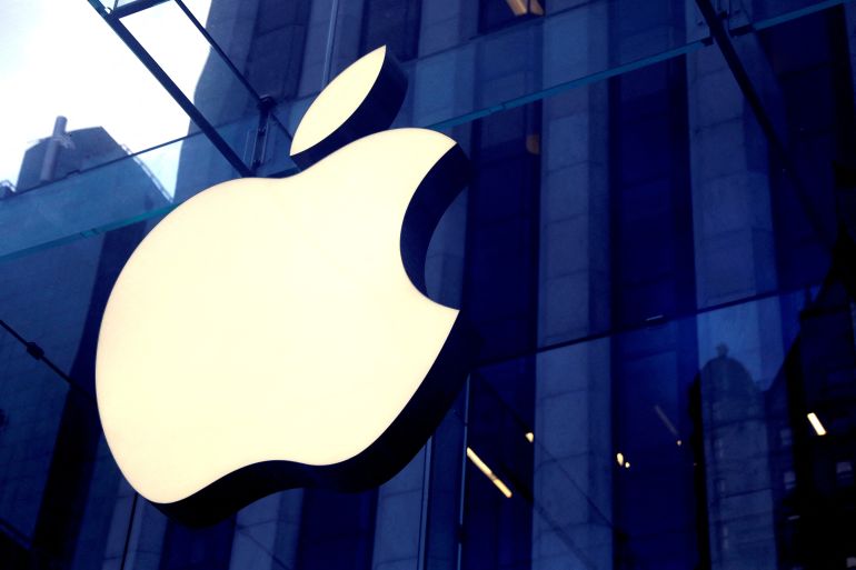 The Apple Inc logo is seen hanging at the entrance to the Apple store on 5th Avenue in Manhattan, New York