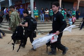 Federal Policemen carry seized material during a search operation for British journalist Dom Phillips and indigenous expert Bruno Pereira, who went missing while reporting in a remote and lawless part of the Amazon rainforest, near the border with Peru, in Atalaia do Norte, Amazonas state, Brazil June 14, 2022.