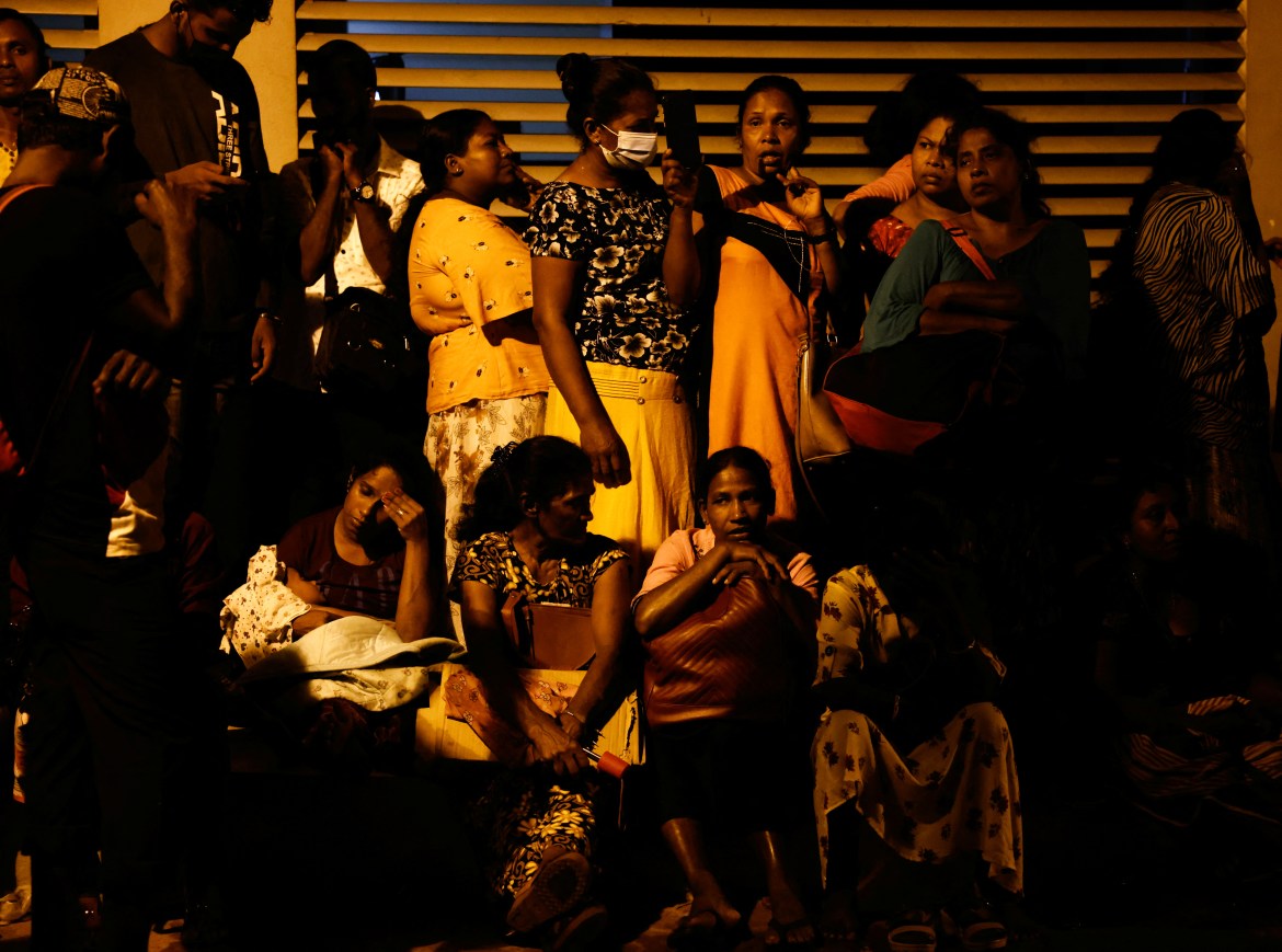 People spend the night outside the Sri Lanka's Immigration and Emigration Department