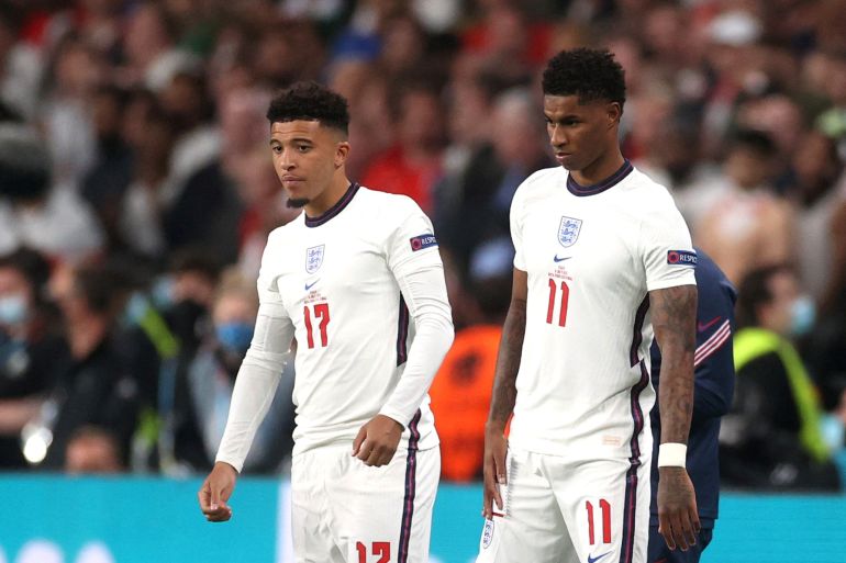 England's Marcus Rashford and Jadon Sancho prepare to come on as substitutes in the Euro Final in July 11, 2021 [File photo: Carl Recine/Reuters]