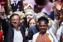 Colombian left-wing presidential candidate Gustavo Petro and his candidate for Vice-President Francia Marquez wave to a crowd in Bogota, Colombia.