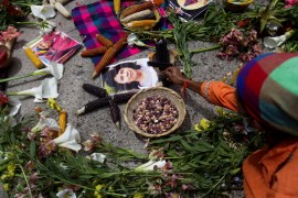 A tribute of flowers and candles for murdered environmental activist Berta Caceres