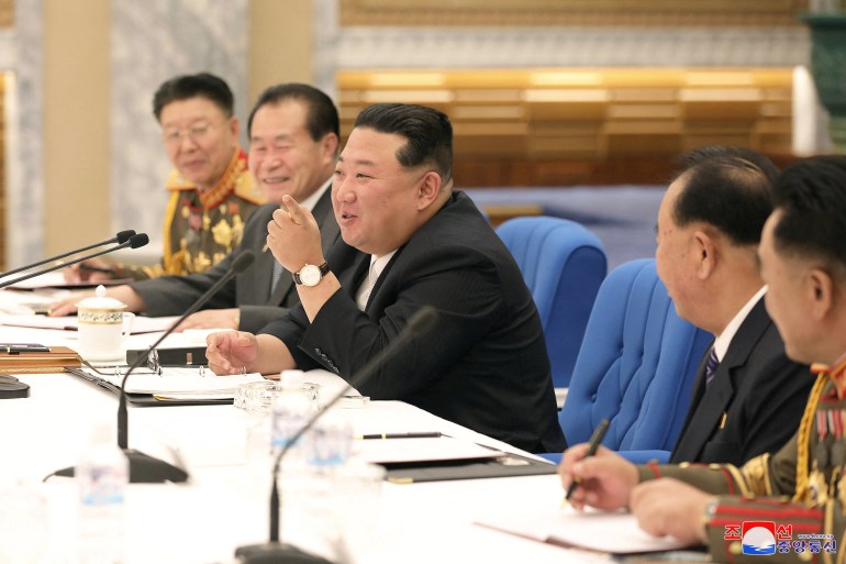 Kim Jong Un attends a meeting with military leaders.