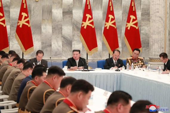 Kim Jong Un in a meeting with other officials.