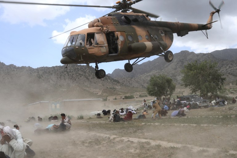 A Taliban helicopter takes off after bringing aid to an area affected by an earthquake in Gayan, Afghanistan, June 23, 2022 [Ali Khara/Reuters]