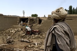 Afghan men examine the damage to their houses on June 23, 2022 after the earthquake in Gayan, Afghanistan [Reuters]