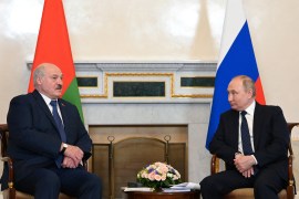 Russian President Vladimir Putin attends a meeting with his Belarusian counterpart Alexander Lukashenko in St Petersburg on Saturday [Maxim Blinov/Kremlin via Reuters]