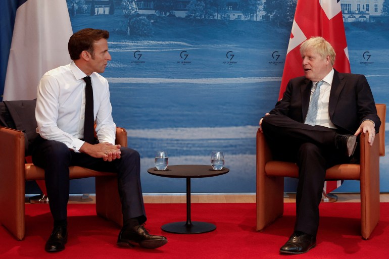 French President Emmanuel Macron and British Prime Minister Boris Johnson hold a bilateral meeting during a G7 leaders summit at Bavaria's Schloss Elmau castle, near Garmisch-Partenkirchen, Germany June 26, 2022. 