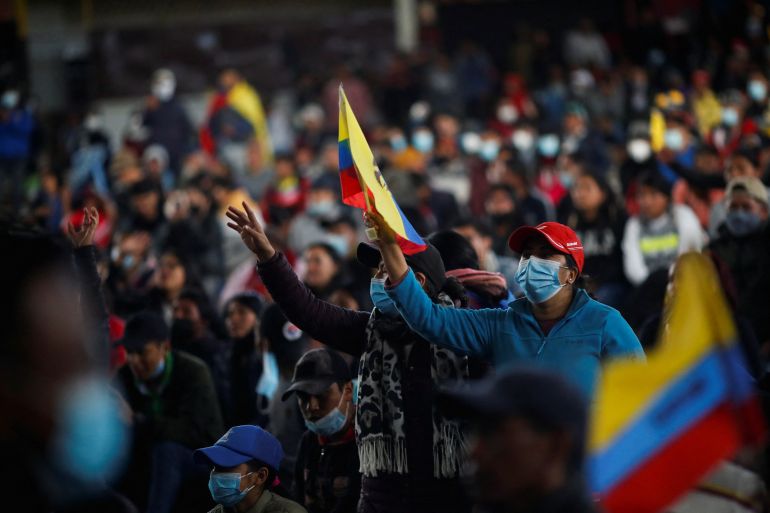 A demonstrator waves an Ecuadorian flag during a cultural festival amid a stalemate between the government of President Guillermo Lasso and largely indigenous demonstrators who demand an end to emergency measures, at Ecuador's Culture House, in Quito, Ecuador June 26, 2022. REUTERS/Adriano Machado