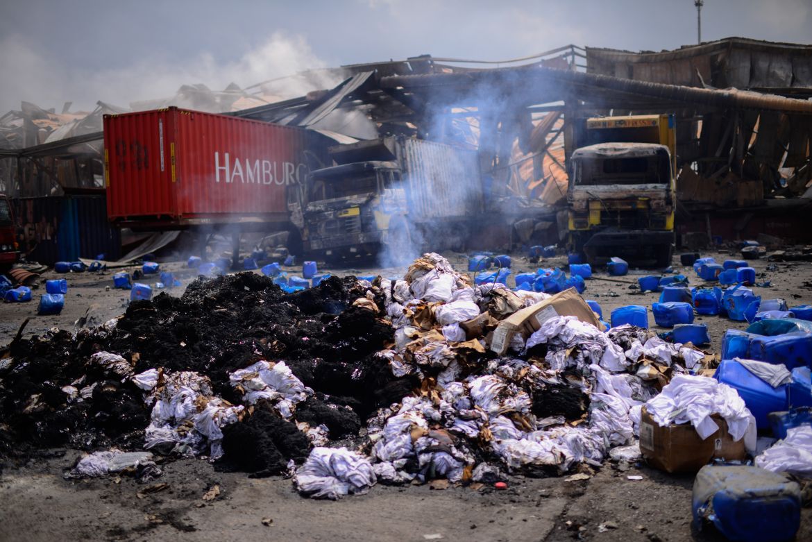 Containers of hydrogen peroxide, lie scattered after the explosion at the BM Inland Container Depot.