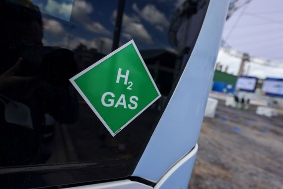 Green hydrogen sticker on a car window.