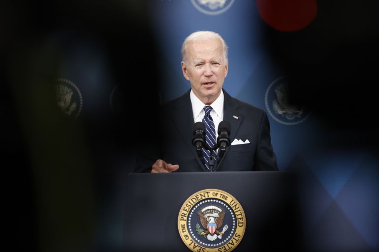 Biden at podium with presidential seal