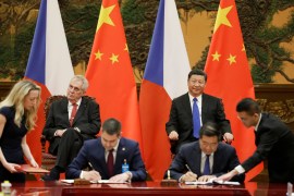 Czech President Milos Zeman, back left, and Chinese President Xi Jinping, back right, attend a signing ceremony at the Great Hall of the People in Beijing