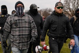 Proud Boys members Joseph Biggs, left, and Ethan Nordean, right with megaphone, walk towards the US Capitol in Washington on January 6, 2021