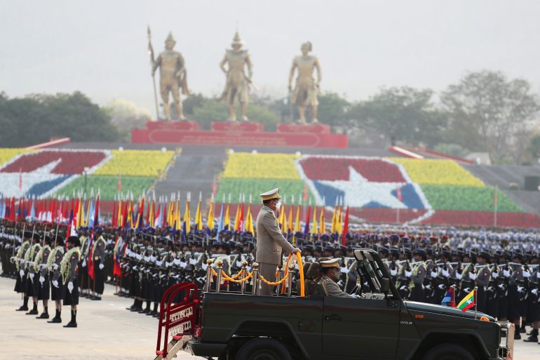 Senior General Min Aung Hlaing surveys his troops at the massive parade ground in Nay Pyi Taw on Armed Forces Day in 2022.