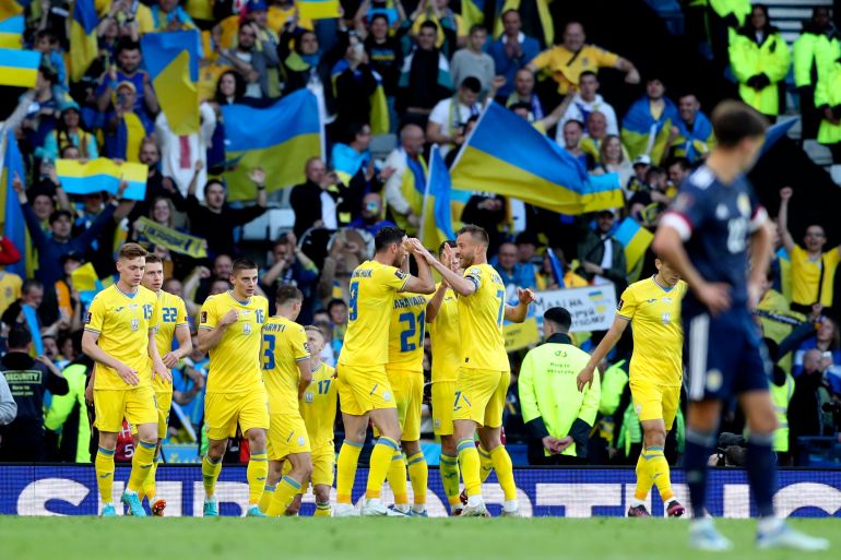 Ukraine's Roman Yaremchuk celebrates with teammates after scoring his side's second goal during the World Cup 2022 qualifying play-off soccer match between Scotland and Ukraine at Hampden Park stadium in Glasgow, Scotland on Wednesday, June 1, 2022 [Scott Heppell/AP]
