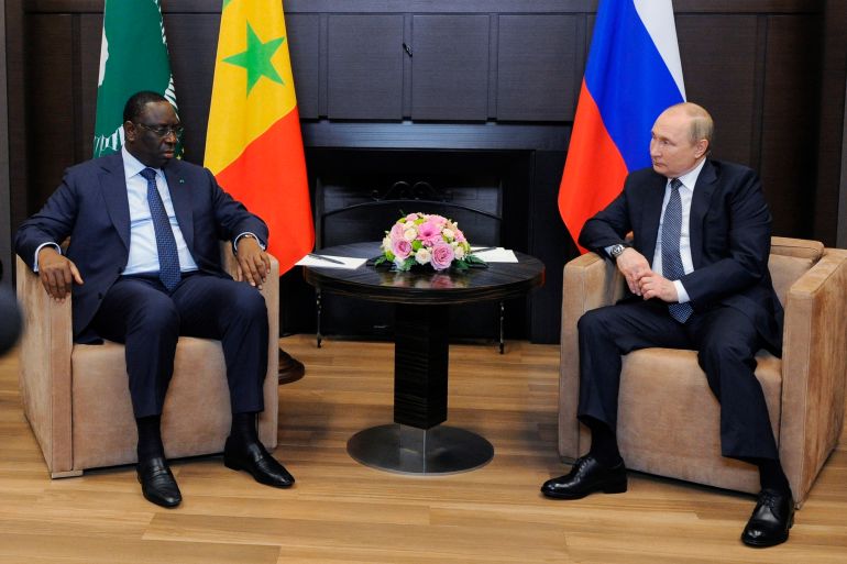 Russian President Vladimir Putin, right, listens to Senegalese President and the chairman of the African Union Macky Sall during their meeting in the Bocharov Ruchei residence in the Black Sea resort of Sochi, Russia,