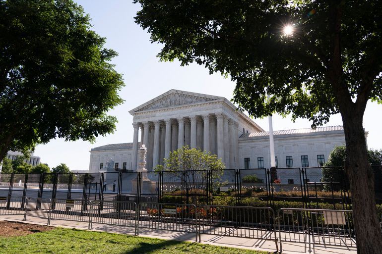 The US Supreme Court surrounded by a wire fence