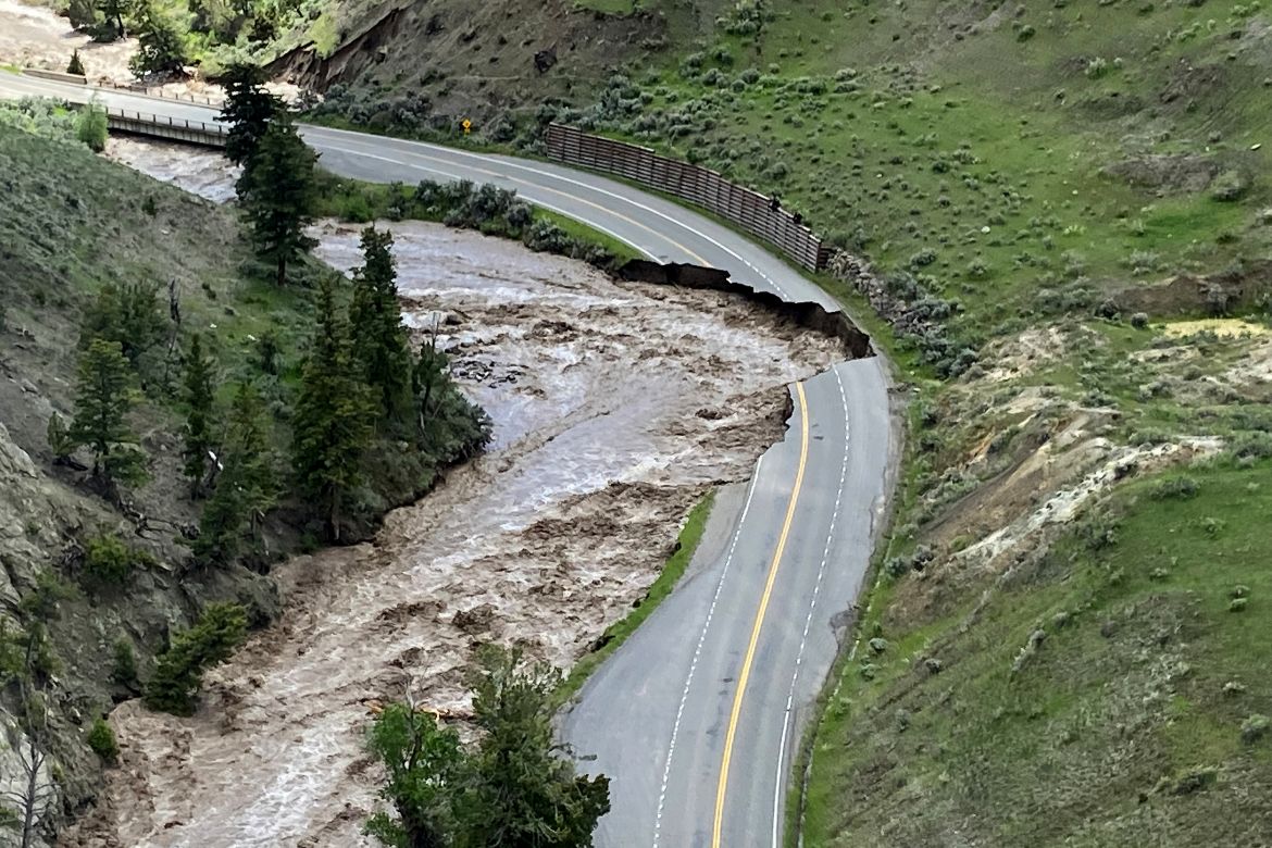 This aerial photo provided by the National Park Service shows a washed out road at North Entrance Road