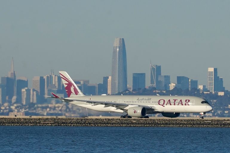 FILE - A Qatar Airways plane prepares to take off at San Francisco International Airport in San Francisco. Qatar Airways, one of the Mideast's largest carriers, says profits over the past fiscal year topped $1.5 billion. It marks the highest ever earnings for the state-owned carrier as it prepares to see a record surge in travellers for the upcoming FIFA World Cup soccer games, which will be held in Qatar later this year.