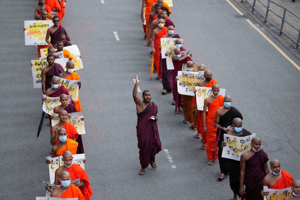 Sri Lankan student Buddhist monks shout slogans as they march demanding President Gotabaya Rajapaksa resign