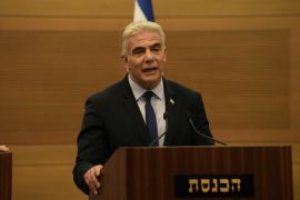 Israeli Foreign Minister Yair Lapid speaks during a joint statement with Prime Minister Naftali Bennett, at the Knesset, Israel's parliament, in Jerusalem, June 20, 2022