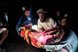 In this photo released by a state-run news agency Bakhtar, Afghans evacuate wounded in an earthquake in the province of Paktika, eastern Afghanistan, Wednesday, June 22, 2022. (Bakhtar News Agency via AP)