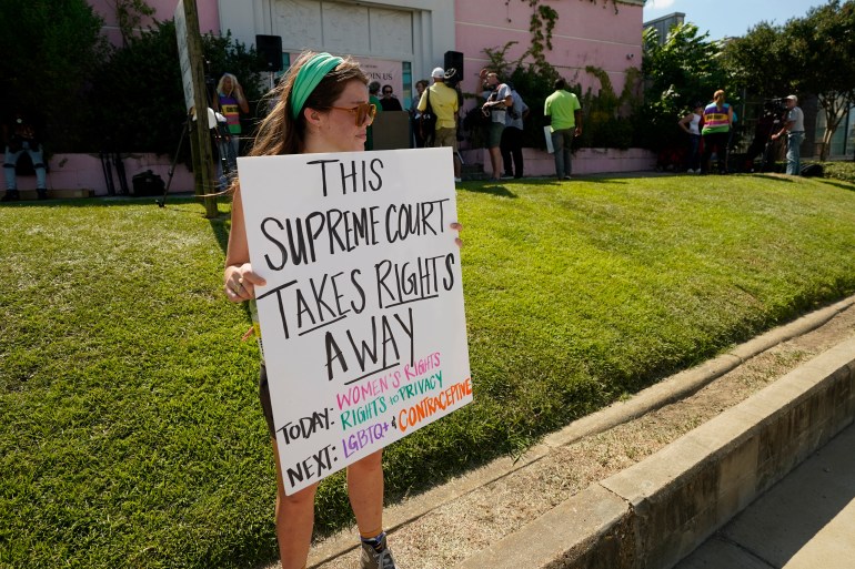 An abortion rights supporter holds her protest sign