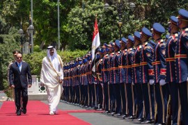 Qatari Emir Tamim bin Hamad Al Thani, and Egyptian President Abdel-Fattah el-Sissi, review an honour guard at the presidential palace in Cairo, Egypt on Saturday, June 25, 2022 [QNA via AP]